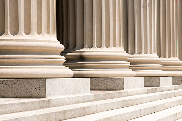 Classical columns representing governance and brand compliance