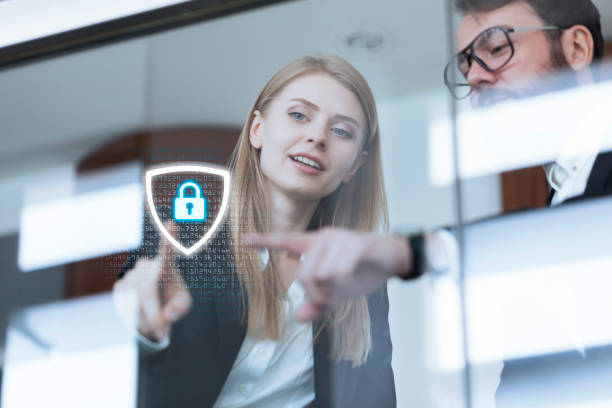 Team pointing at a digital security shield, symbolizing brand control.