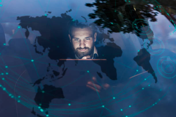 Person analyzing global network data on laptop with world map and connection nodes overlay