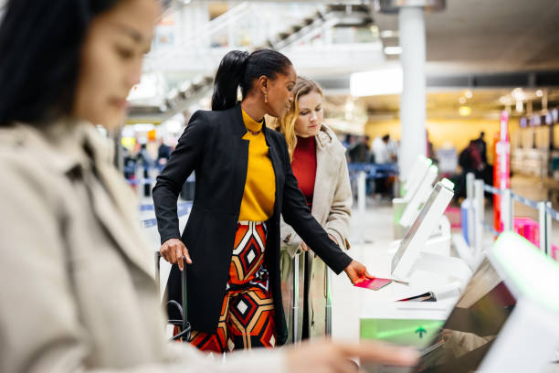 People using self-service kiosks at an airport, symbolizing an easy-to-use platform for non-experts.