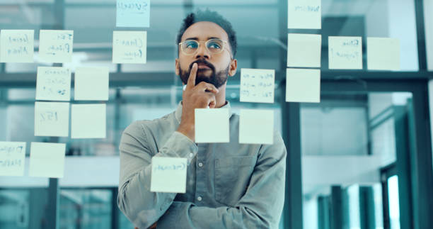 Person analyzing data and charts on multiple screens, representing strategic media planning